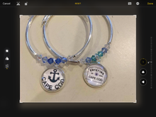 Load image into Gallery viewer, Entering town hand created charms. You can use your logo too!
